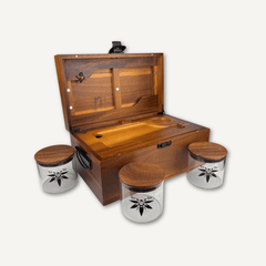 Extra-large dark acacia BzzBox Treasure Chest stash box, open on a coffee table with magnetic tray and airtight jars