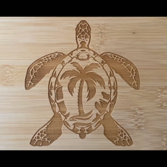 Wooden cutting board with a turtle design on a wooden background