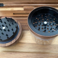 Wooden and metal grinder on a wooden surface