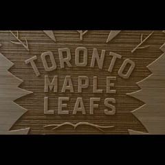 Wooden plaque with 'Toronto Maple Leafs' engraved on it