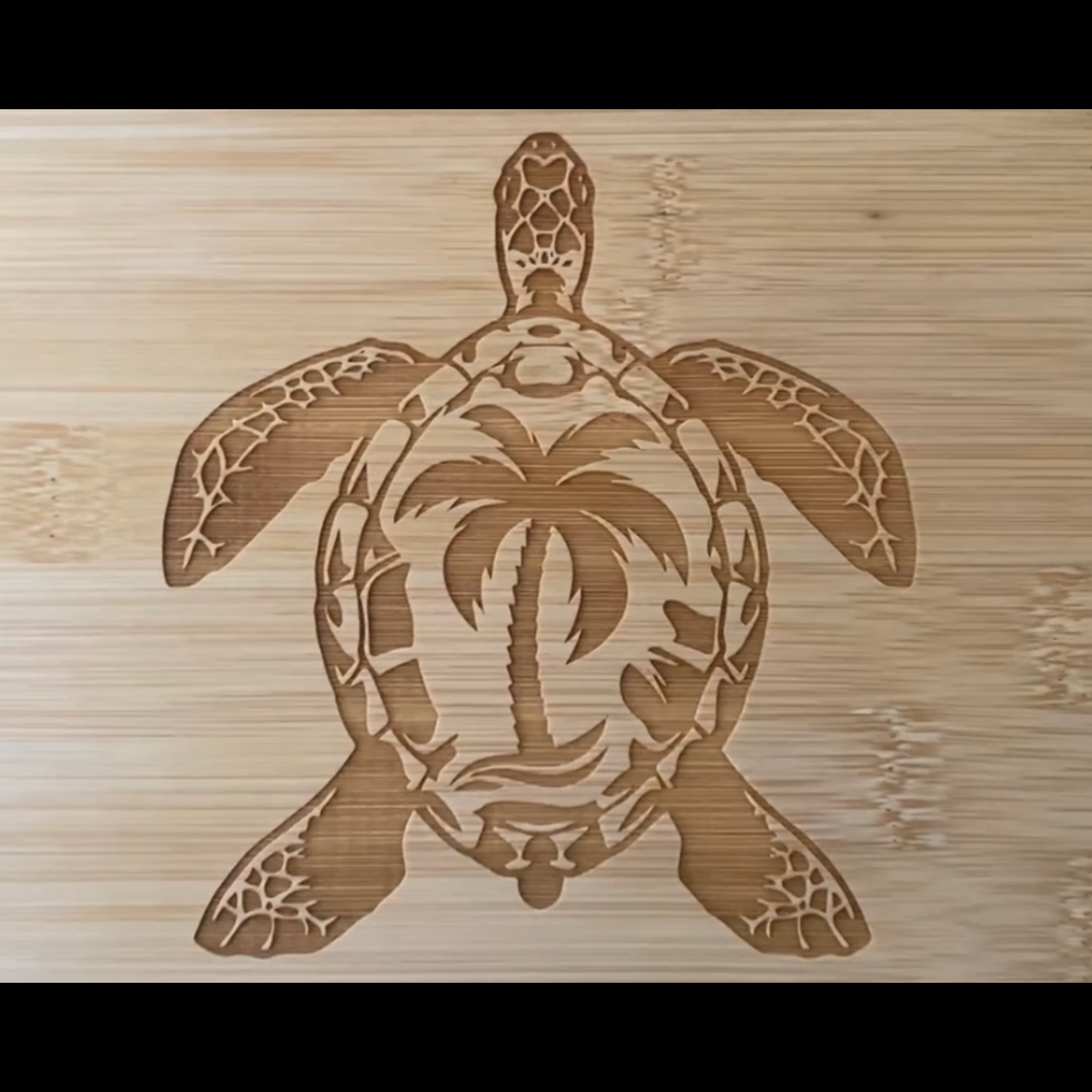 Wooden cutting board with a turtle design on a wooden background